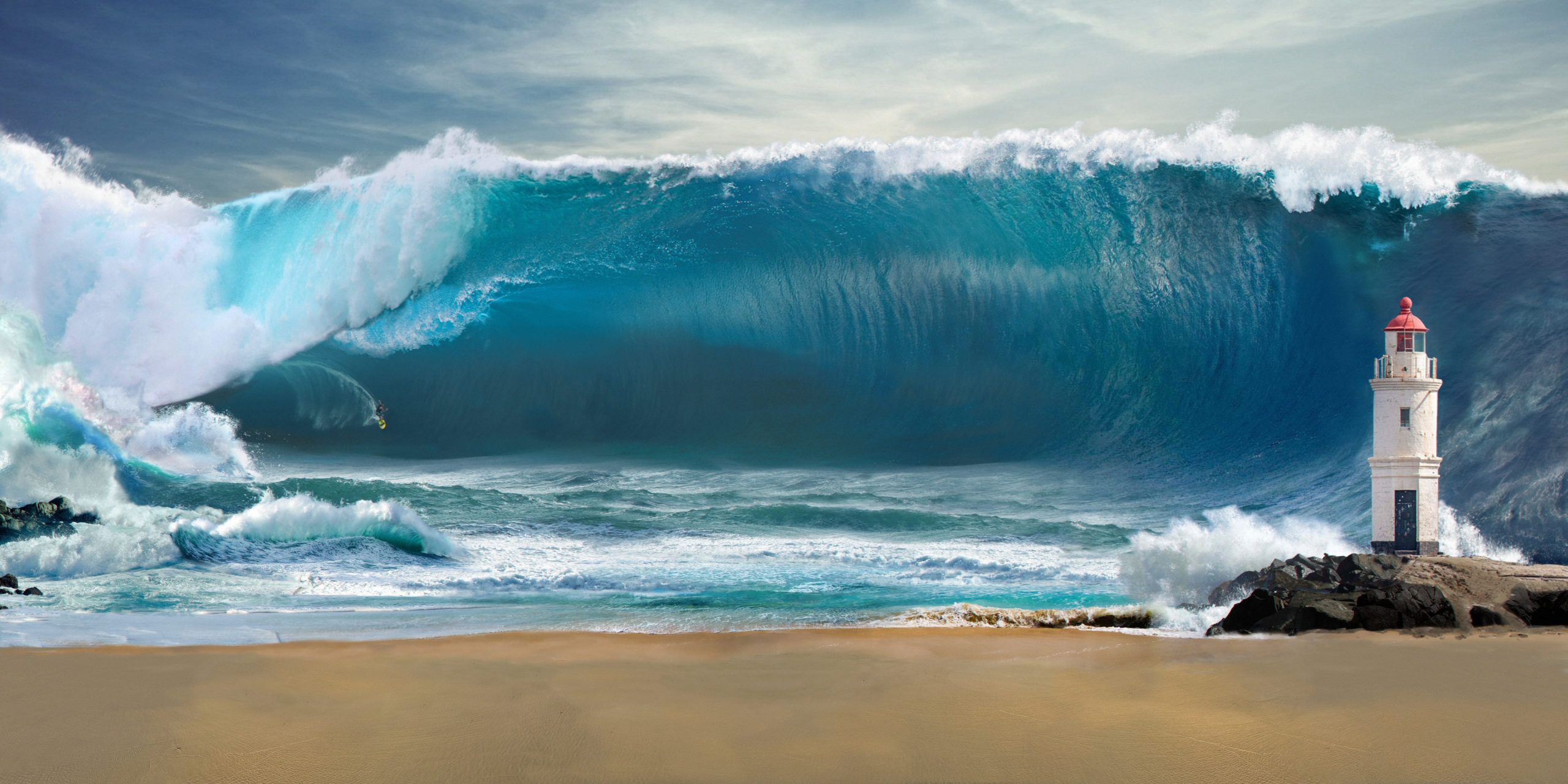 Massive turquoise tsunami wave towering over a sandy beach and small red-topped lighthouse on rocky shore.