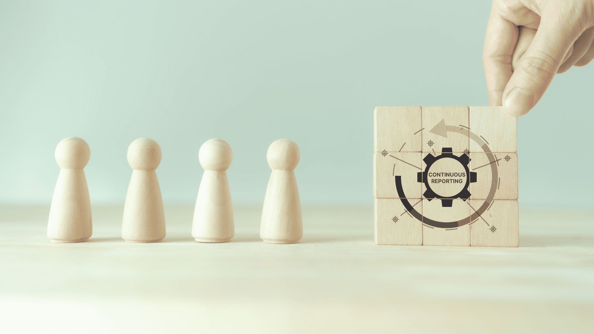 Four wooden peg figures stand in a row beside a hand assembling wooden blocks displaying a "Continuous Reporting" gear icon.