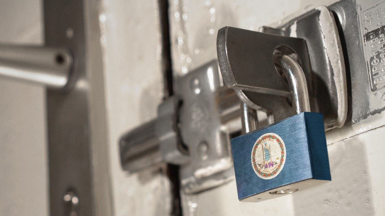 Blue padlock featuring the Virginia state seal secured on a metal door latch, symbolizing the Virginia Consumer Data